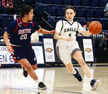 Lady Golden Eagles hoopsters win opening playoff game and will face San Joaquin Delta in second round West Hills Lemoore's Clarissa Chavez drives for the basket Tuesday night in the Golden Eagle Arena.